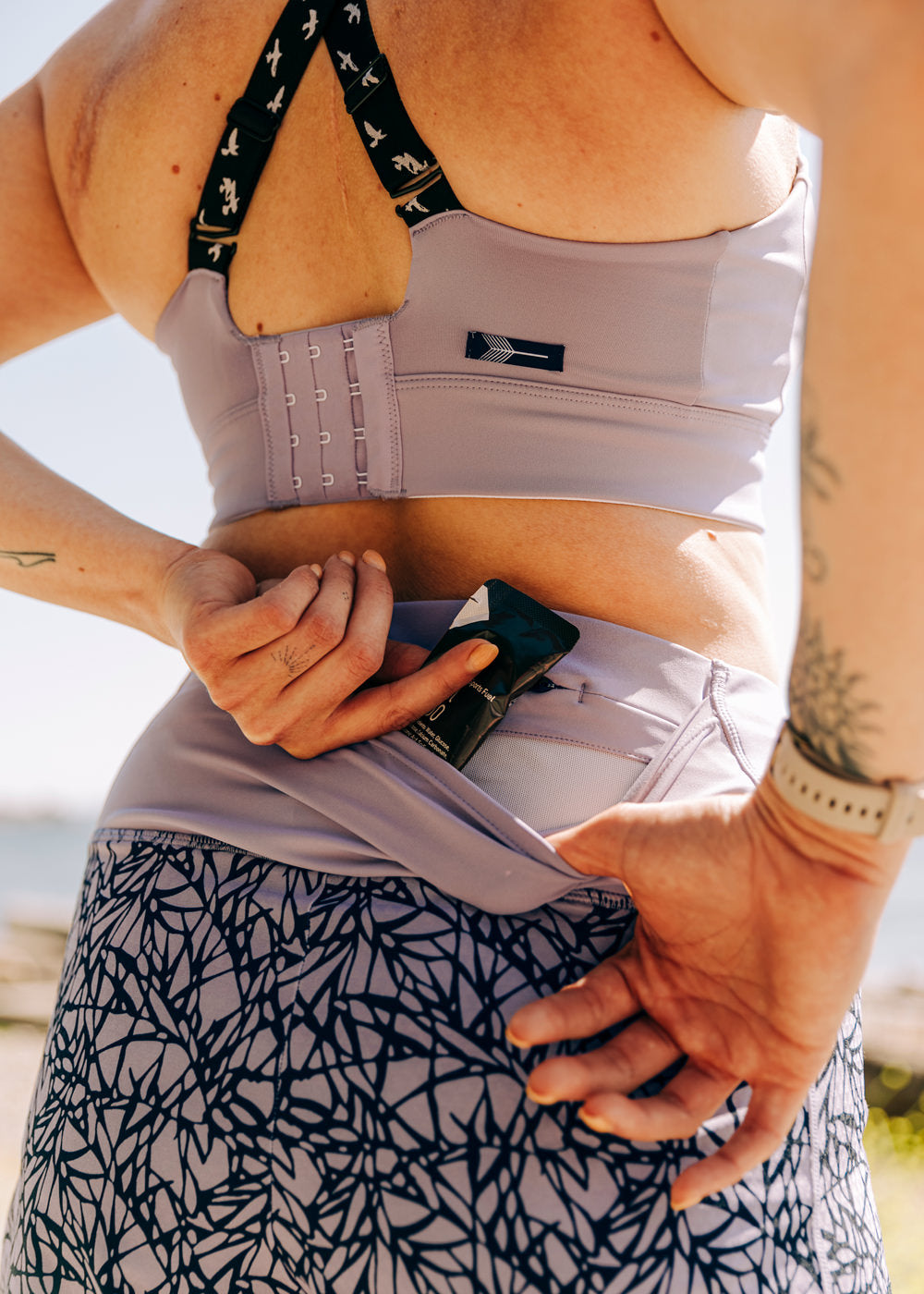 High Rise Roga 6" Running Shorts in Light Purple Lavender print, close up of back pocket detail