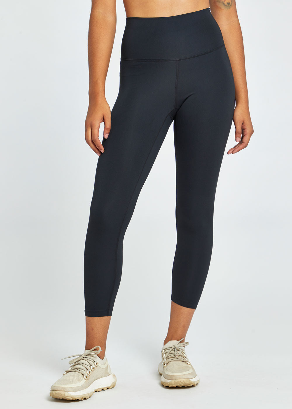 Essential Bird 3/4 length Running Tights in black, front view