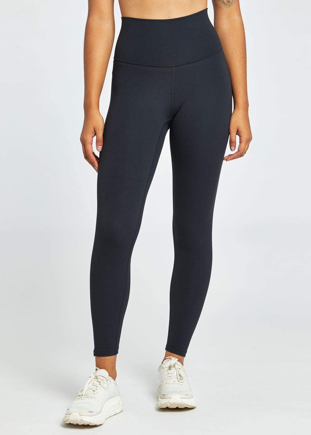 Essential Bird 7/8 length Running Tights in Black, front view
